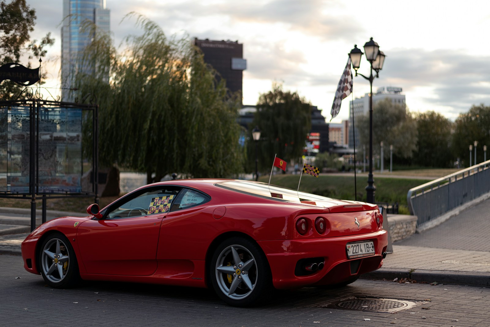 a red sports car parked on the side of a road
